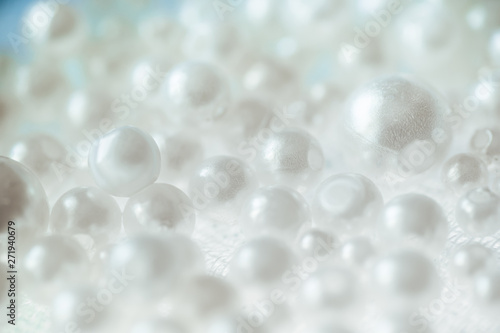 White Pile of pearls and beads on the background