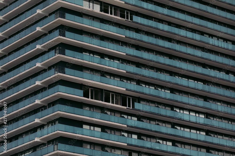 Facade of a modern apartment building. Exterior of building Facade of a modern apartment building. Exterior of building