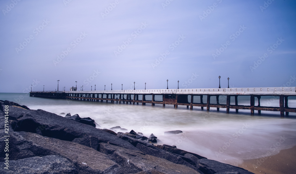 Old pier at Promenade Beach. Rock Beach is the popular stretch of beachfront in the city of Puducherry, India, along the Bay of Bengal