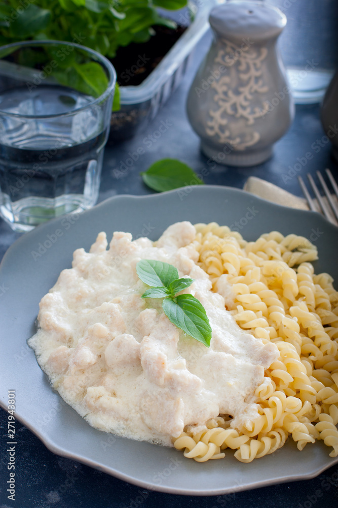 Chicken breast fricassee with pasta, selective focus Chicken breast fricassee with pasta, selective focus