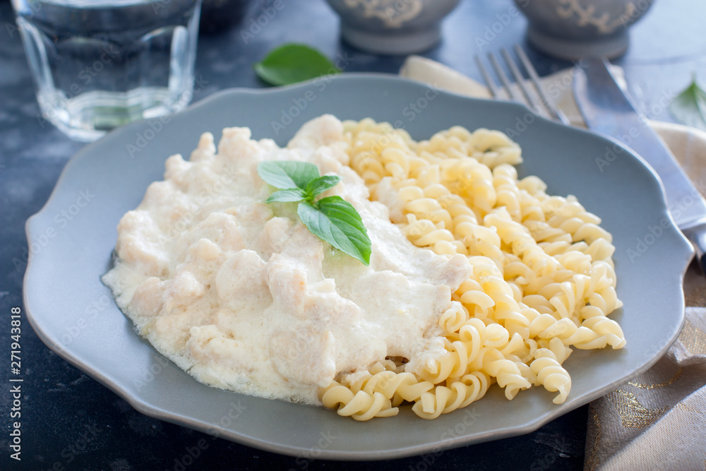 Fricassee, chicken meat in a creamy sauce, with pasta, horizontal Fricassee, chicken meat in a creamy sauce, with pasta, horizontal