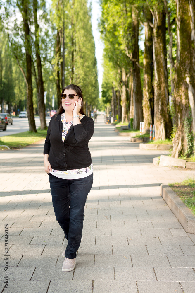 Lady Walks on the Streets of Munich while Working on the Go