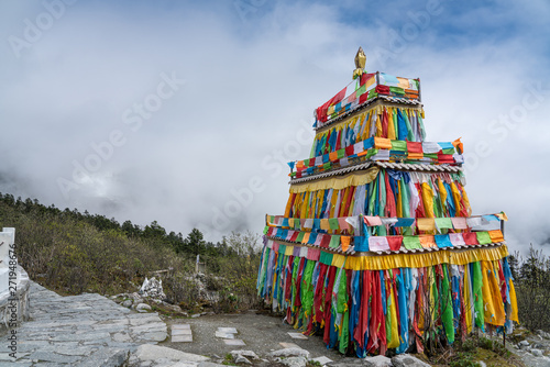 Colorful prayer tower on the top of the 4th camp of Hailuogou Glacier Forest Park photo