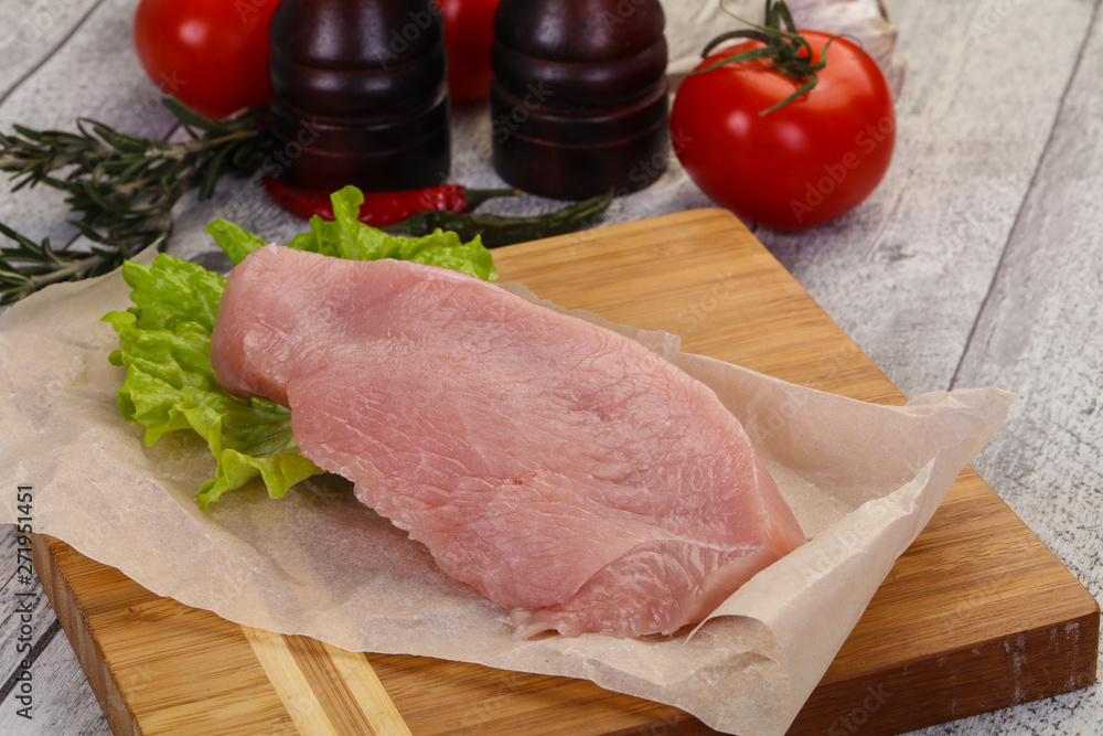 Raw Turkey steak served rosemary Raw Turkey steak served rosemary