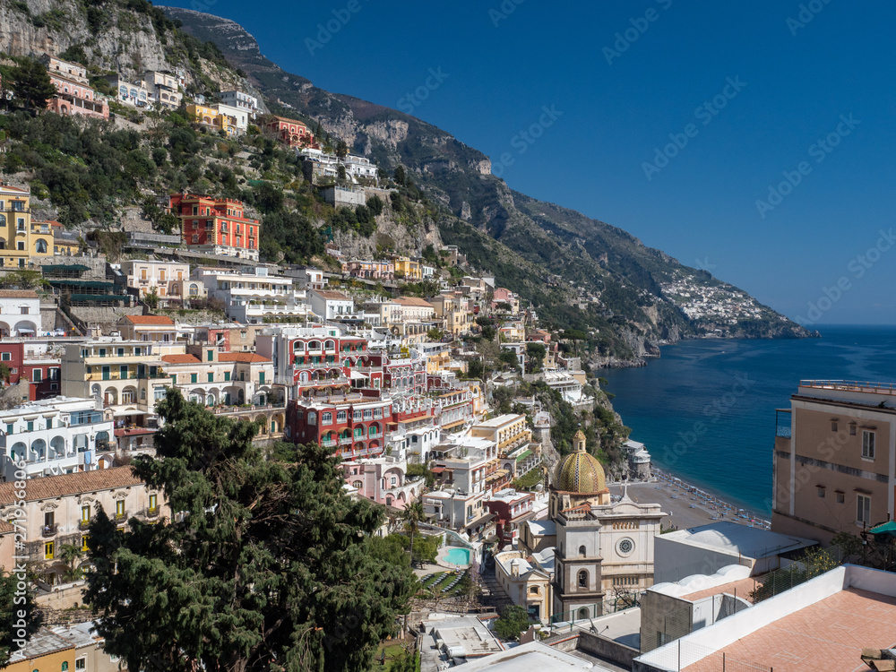 Beautiful panoramic view of the beach anf colorful buildings in Positano at Amalfi Coast, Italy. May, 2019