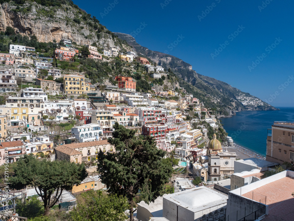 Beautiful panoramic view of the beach anf colorful buildings in Positano at Amalfi Coast, Italy. May, 2019