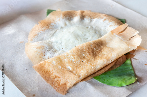 Penang famous apom manis, Served on banana leaf. photo