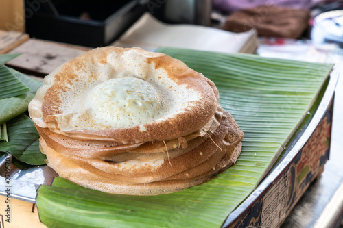 Penang famous apom manis, Served on banana leaf. photo