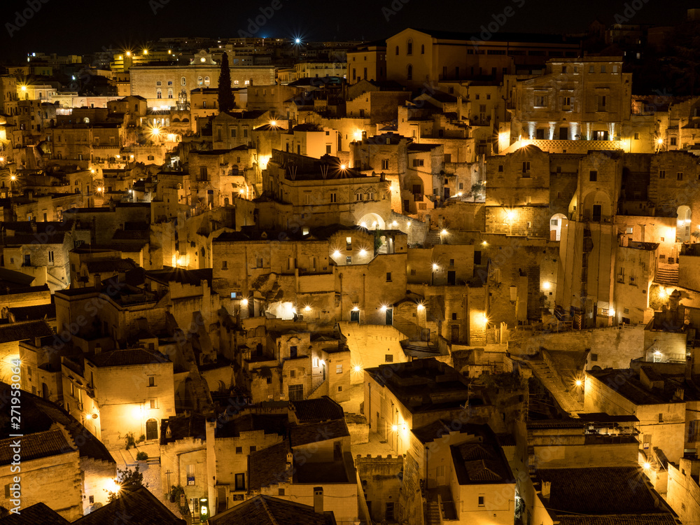 MATERA, BASILICATA, ITALY - May, 2019 - Nightly view of the ancient town of Matera (Sassi di Matera), European Capital of Culture 2019 MATERA, BASILICATA, ITALY - May, 2019 - Nightly view of the ancient town of Matera (Sassi di Matera), European Capital of Culture 2019