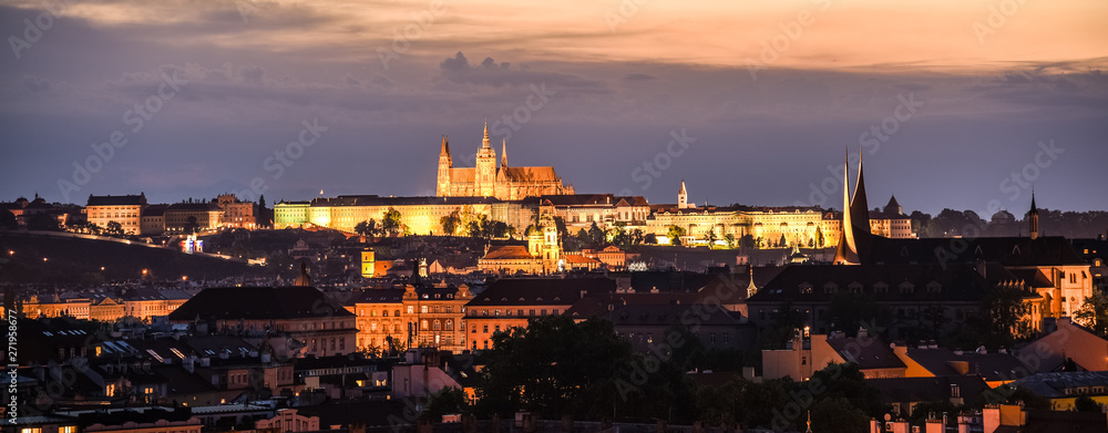 Prague cityscape by night with illuminated Prague Castle