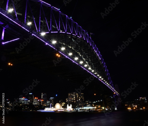 Sydney, Australia - May 27, 2019.  Harbour Bridge and Luna Park illuminated with colourful light design imagery during the Vivid Sydney 2019 free annual public event.