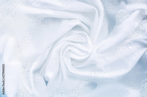 Soak a cloth before washing  white cloth.