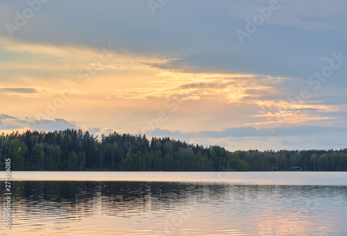 The natural landscape of Russia. large lake overlooking the forest at sunset. Colorful scenic landscape.