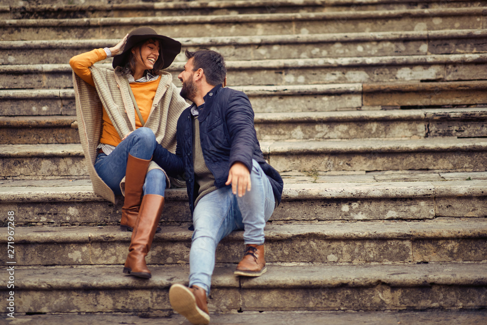 Man and woman relaxing on the stairs while enjoying in vacation. Man and woman relaxing on the stairs while enjoying in vacation.
