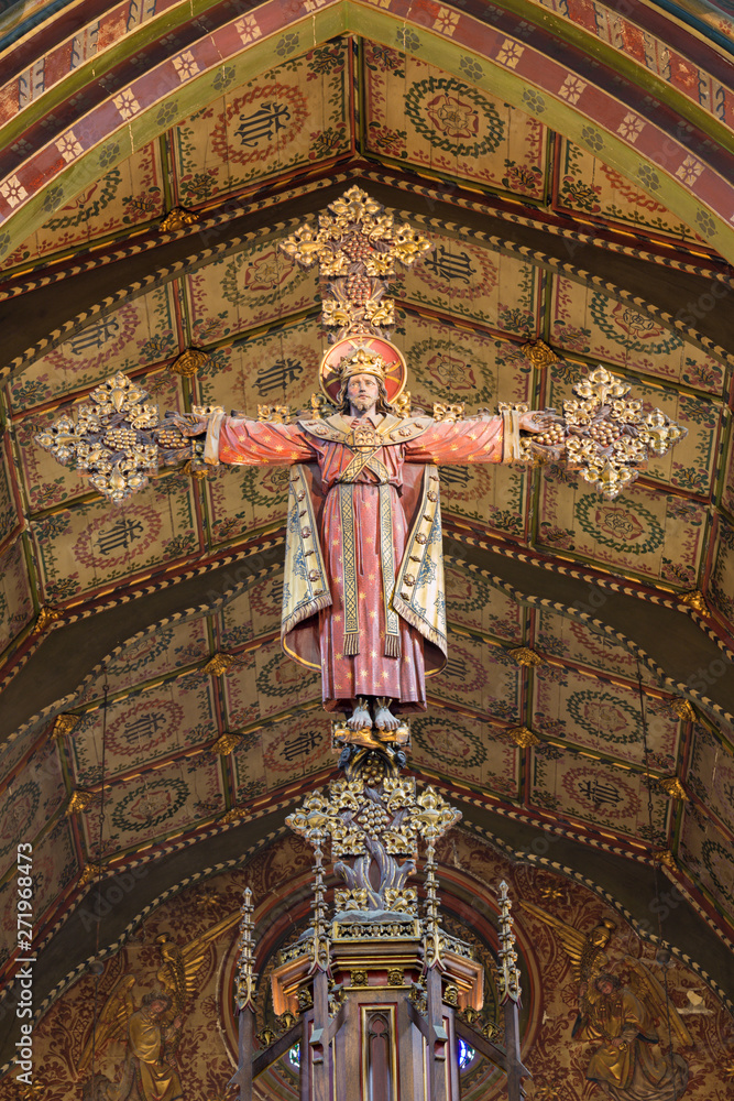LONDON, GREAT BRITAIN - SEPTEMBER 17, 2017: The carved Crucifixion of Jeus as the king and priest in church St. Barnabas designed by Bodley in 1906.
