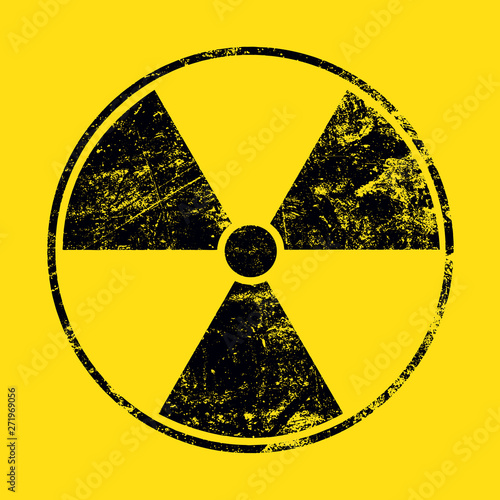 Black radioactive sign over yellow background