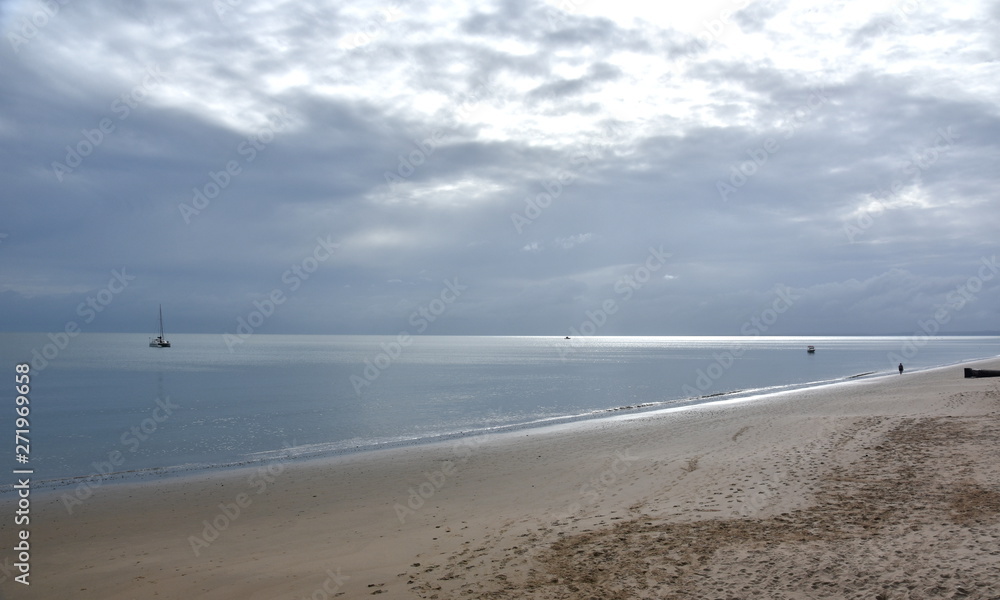 Gushing sea on a cloudy day. Horizontal view of dramatic overcast sky and sea. Fifty shades of blue and gray. Gushing sea on a cloudy day. Horizontal view of dramatic overcast sky and sea. Fifty shades of blue and gray.