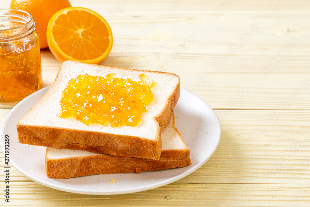 Slices of bread with orange jam Slices of bread with orange jam