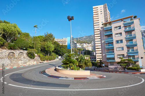 Fototapeta Monte Carlo street curve with formula one red and white signs in a sunny summer