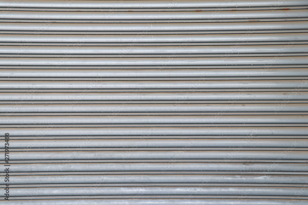 Rolling steel door background. Steel rolling door surface. Rolling steel door background. Steel rolling door surface.