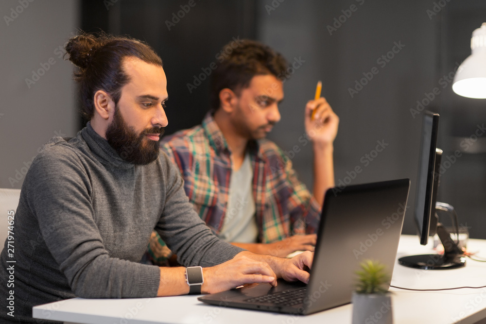 deadline, technology and people concept - creative team with computers working late at night office deadline, technology and people concept - creative team with computers working late at night office