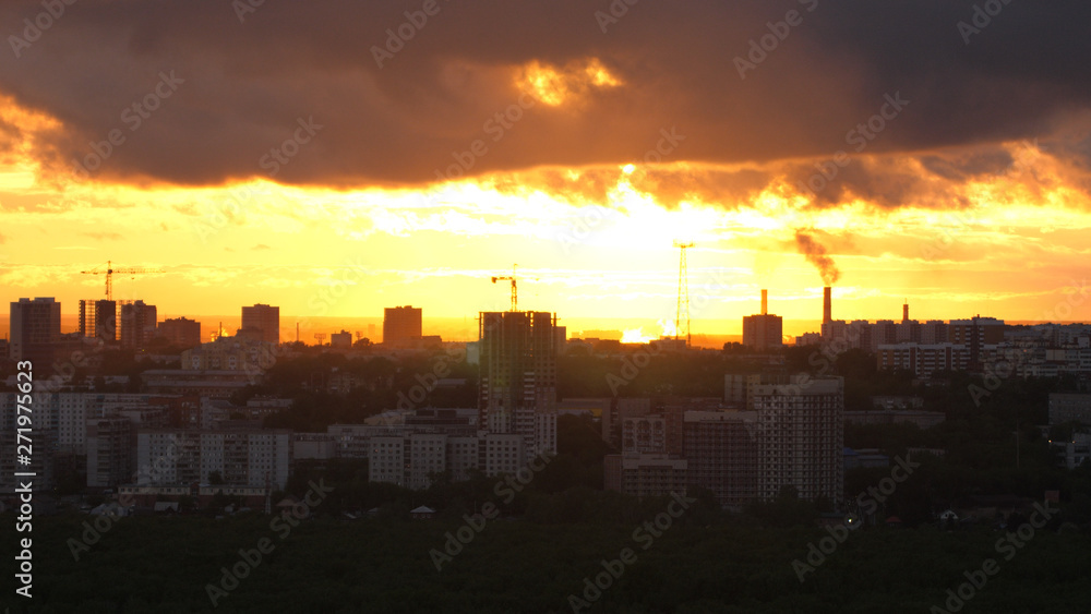 Sunset over city, close up on modern downtown Novosibirsk skyline buildings