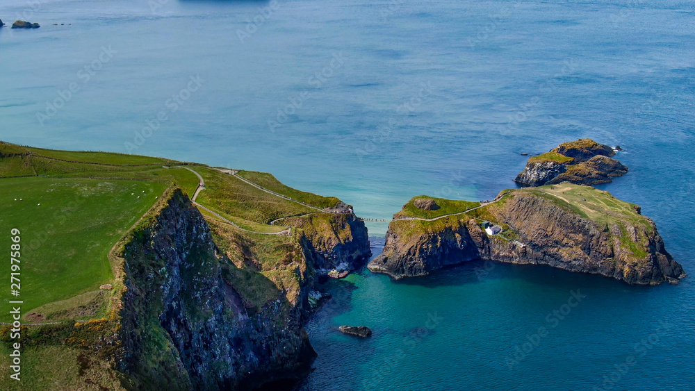 Fototapeta premium Aerial view over Carrick-A-Rede Rope Bridge in North Ireland - travel photography