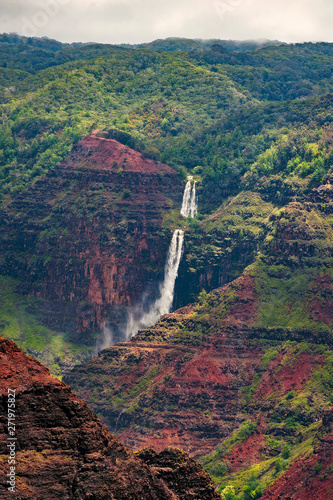 Waipo'o Falls, Waimea Canyon, Kauai, Hawaii. Waipo'o Falls is a fantastic waterfall on Kokee Stream dropping 800 ft. in two tiers. It is located in the heart of the Waimea Canyon. photo