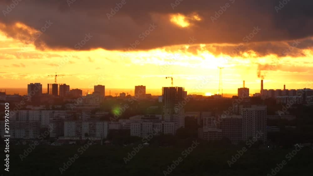 Beautiful sunset over city, close up on modern downtown Novosibirsk skyline buildings Beautiful sunset over city, close up on modern downtown Novosibirsk skyline buildings