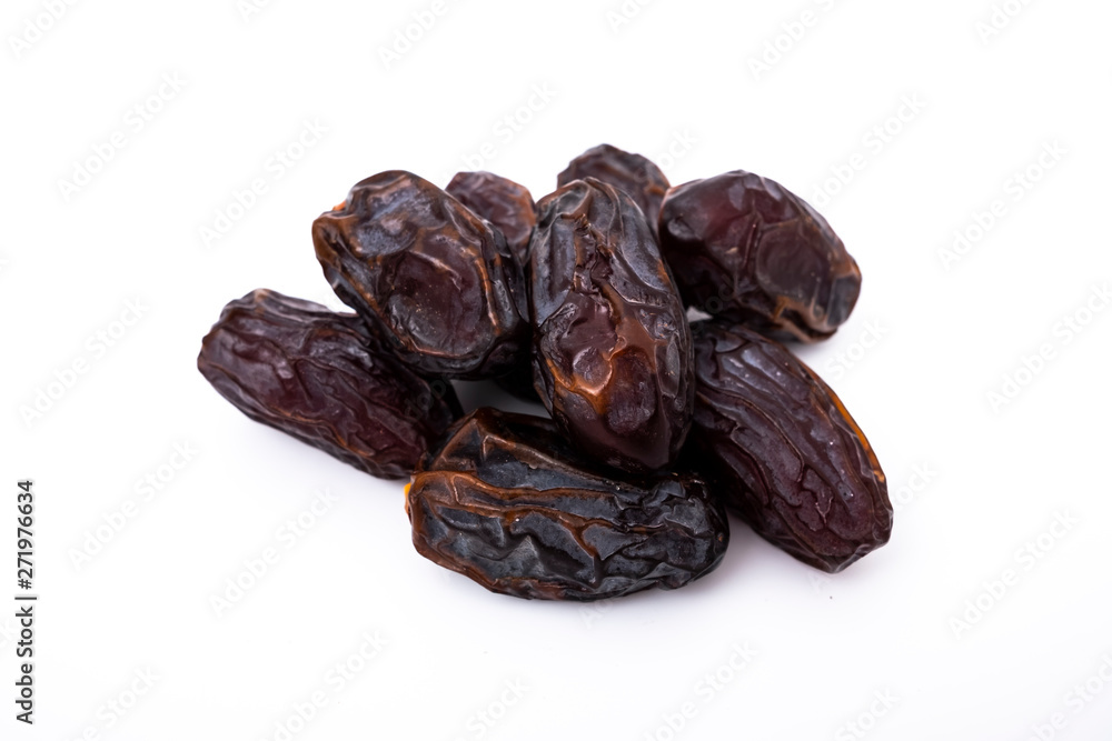 Heap of dried dates or date fruit isolated on white background Heap of dried dates or date fruit isolated on white background