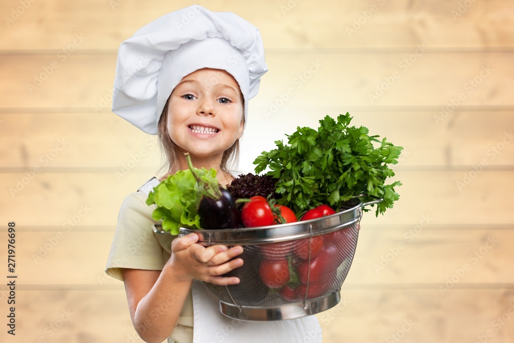Portrait of adorable little girl preparing healthy food at kitchen Portrait of adorable little girl preparing healthy food at kitchen