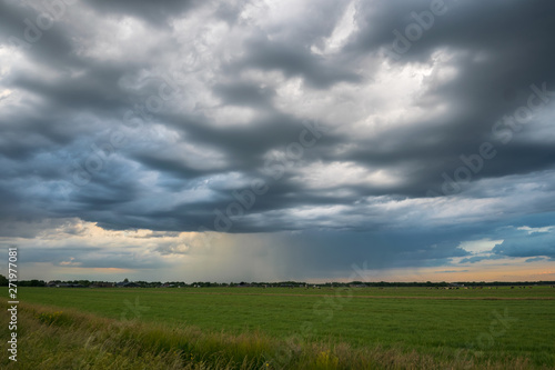 Beautiful textured clouds as a thunderstorm moves away over the countryside of Holland