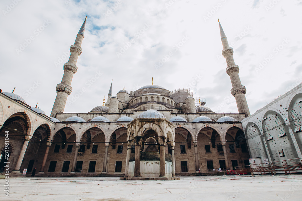 Fatih Mosque or Conqueror Mosque in Istanbul, Turkey. Blue Mosque photographed at a wide angle. Islamic architecture on a sunny summer day. Panoramic view of the courtyard of the mosque.