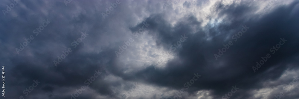 Dramatic Sky Background. Storm clouds in the dark sky. Gloomy Cloudy Landscape. You can use a panoramic image as a web banner or as a broad site Title.
