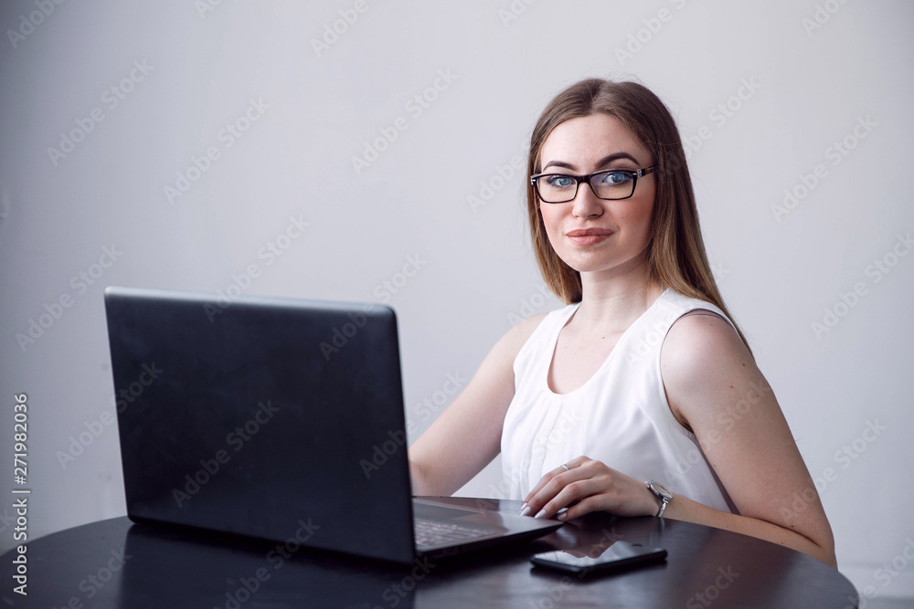 Successful female grapic designer watching tutorial about creative ideas at laptop computer during working process in office.Positive student with blonde hair reading business news on netbook Successful female grapic designer watching tutorial about creative ideas at laptop computer during working process in office.Positive student with blonde hair reading business news on netbook
