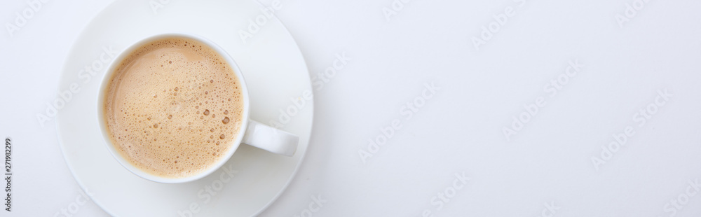 panoramic shot of white cup with delicious hot coffee on white background panoramic shot of white cup with delicious hot coffee on white background