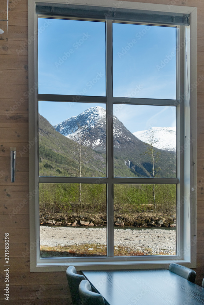 Beautiful view of the nature landscape with snowy mountains from the window, restaurant, cafe, hotel, guest house Beautiful view of the nature landscape with snowy mountains from the window, restaurant, cafe, hotel, guest house