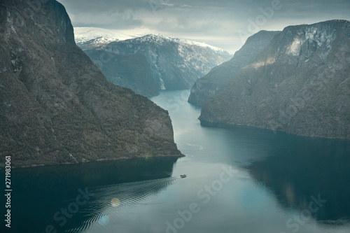 Panoramic views of Aurland Fjord Stegastein viewpoint in spring in Norway on a boat on the water and snow mountains