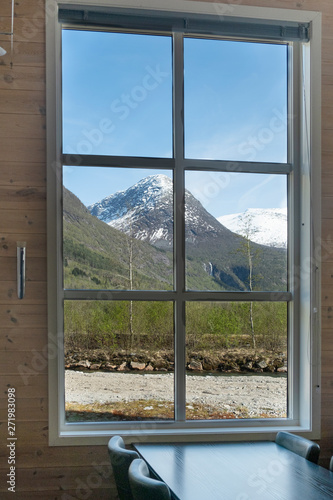  Beautiful view of the nature landscape with snowy mountains from the window  restaurant  cafe  hotel  guest house
