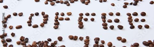 panoramic shot of coffee lettering made of coffee beans on white background