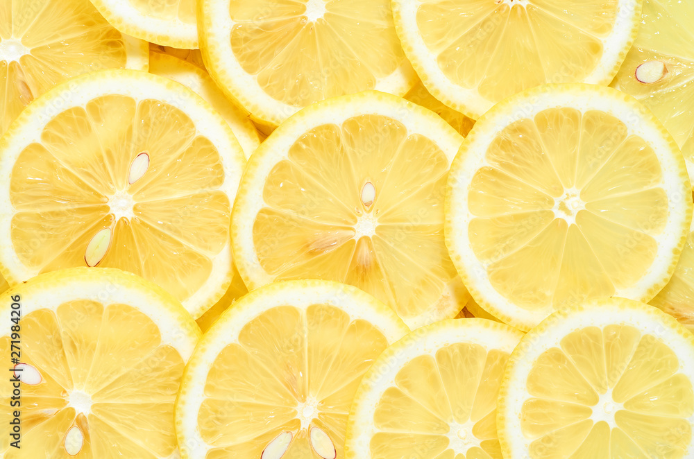 background of heap fresh yellow lemon slices. pattern for your design