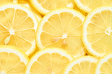 background of heap fresh yellow lemon slices. pattern for your design