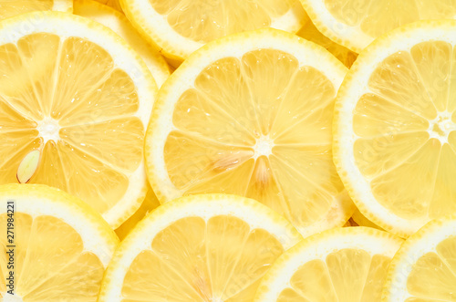 background of heap fresh yellow lemon slices. pattern for your design