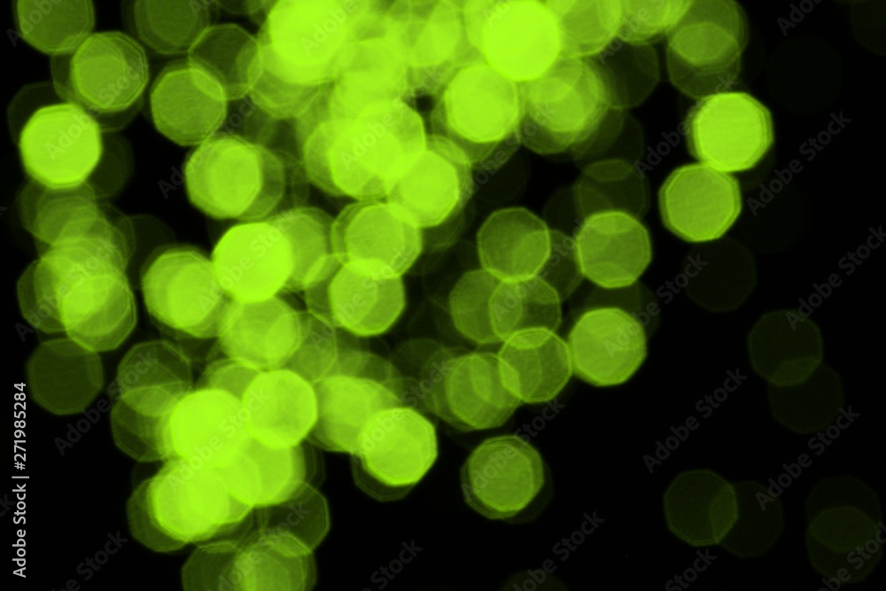 lime bokeh effect of brilliant highlights on black texture - beautiful abstract photo background lime bokeh effect of brilliant highlights on black texture - beautiful abstract photo background
