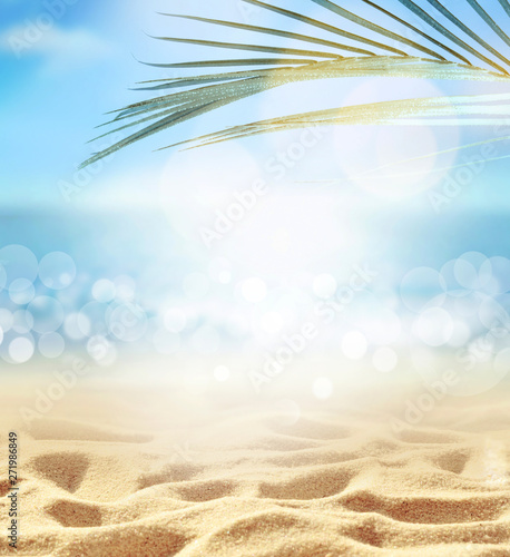 Summer beach background. Sand, palm leaf, sea and sky.