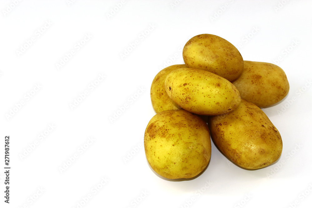 A small slide of six potatoes young and clean on a white background A small slide of six potatoes young and clean on a white background
