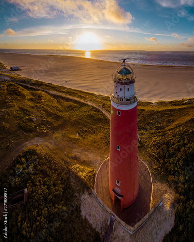 Lighthouse texel Island Netherlands, Lighthouse during sunset on the Island of Texel photo