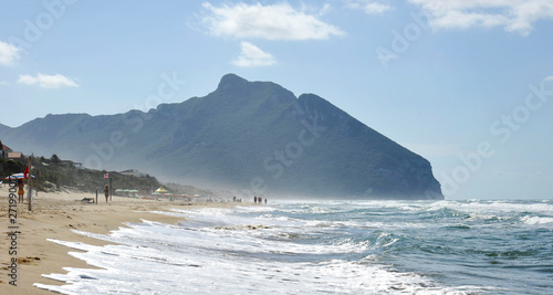 Tableau sur toile Shoreline under a cloudy sky, in the background the famous Circeo mountain, Lazio, Italy