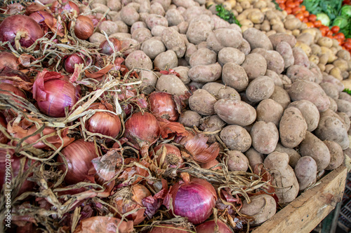 Potatoes and red onions for sale at a souk in Morocco