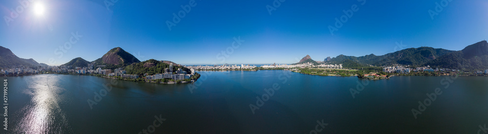 Full 360 degrees aerial panorama of the city lake Lagoa Rodrigo de Freitas in Rio de Janeiro on a bright sunny day with intense clear blue sky Full 360 degrees aerial panorama of the city lake Lagoa Rodrigo de Freitas in Rio de Janeiro on a bright sunny day with intense clear blue sky